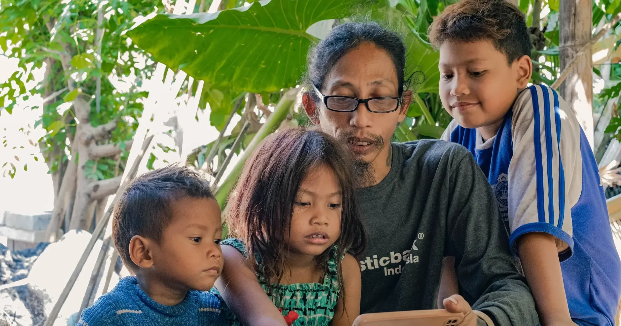 Haris and his wife sharing a moment with their youngest