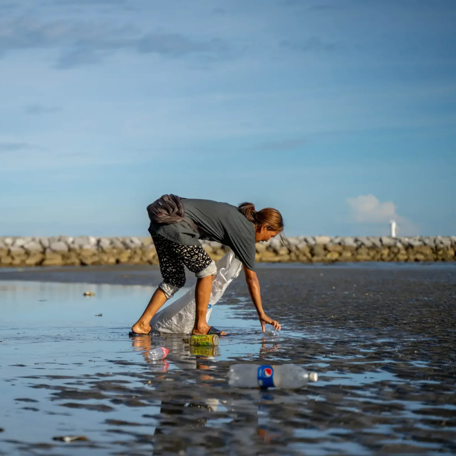 Rasemee collecting at the beach