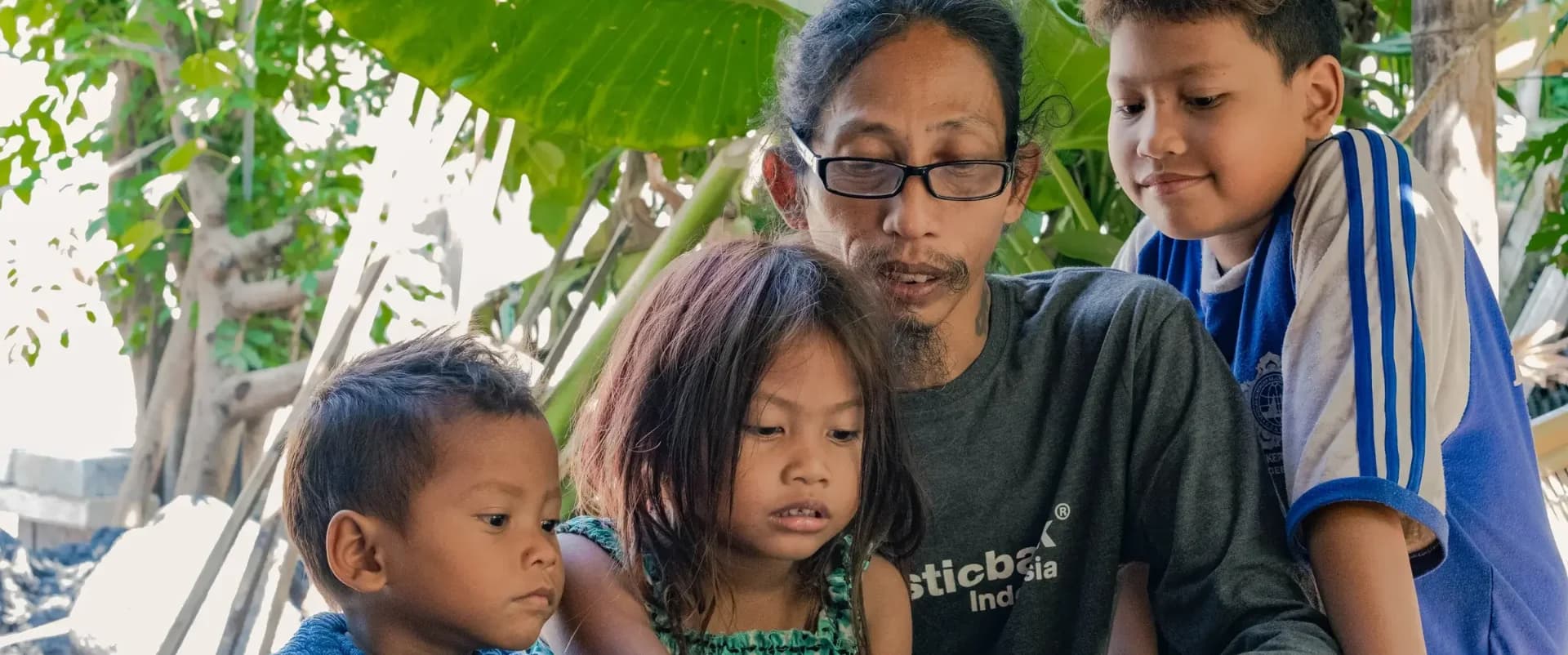 Haris and his wife sharing a moment with their youngest