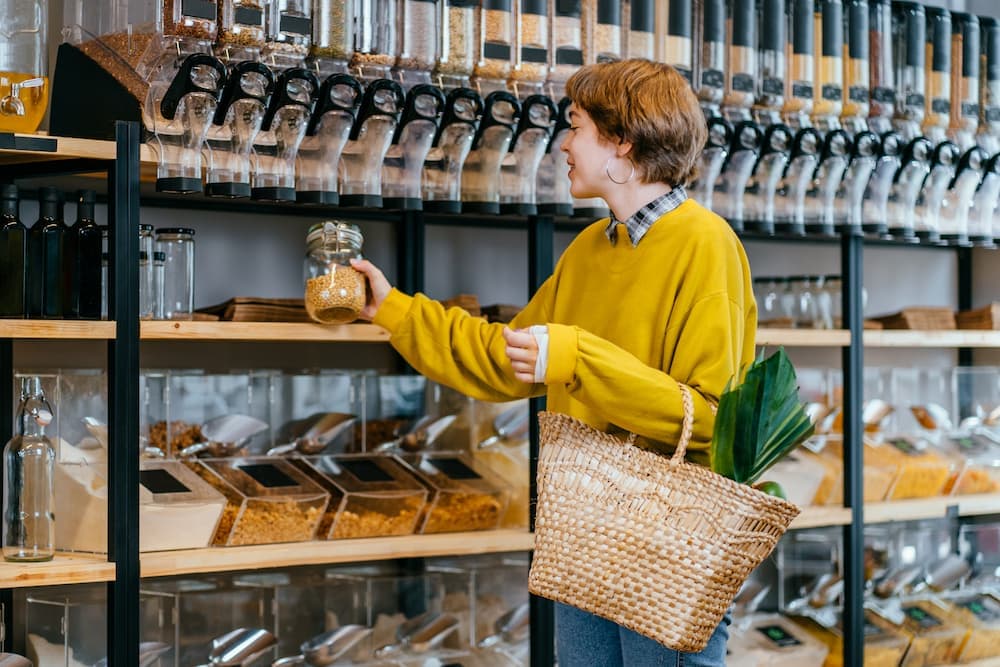 Lady buying in grocery store.