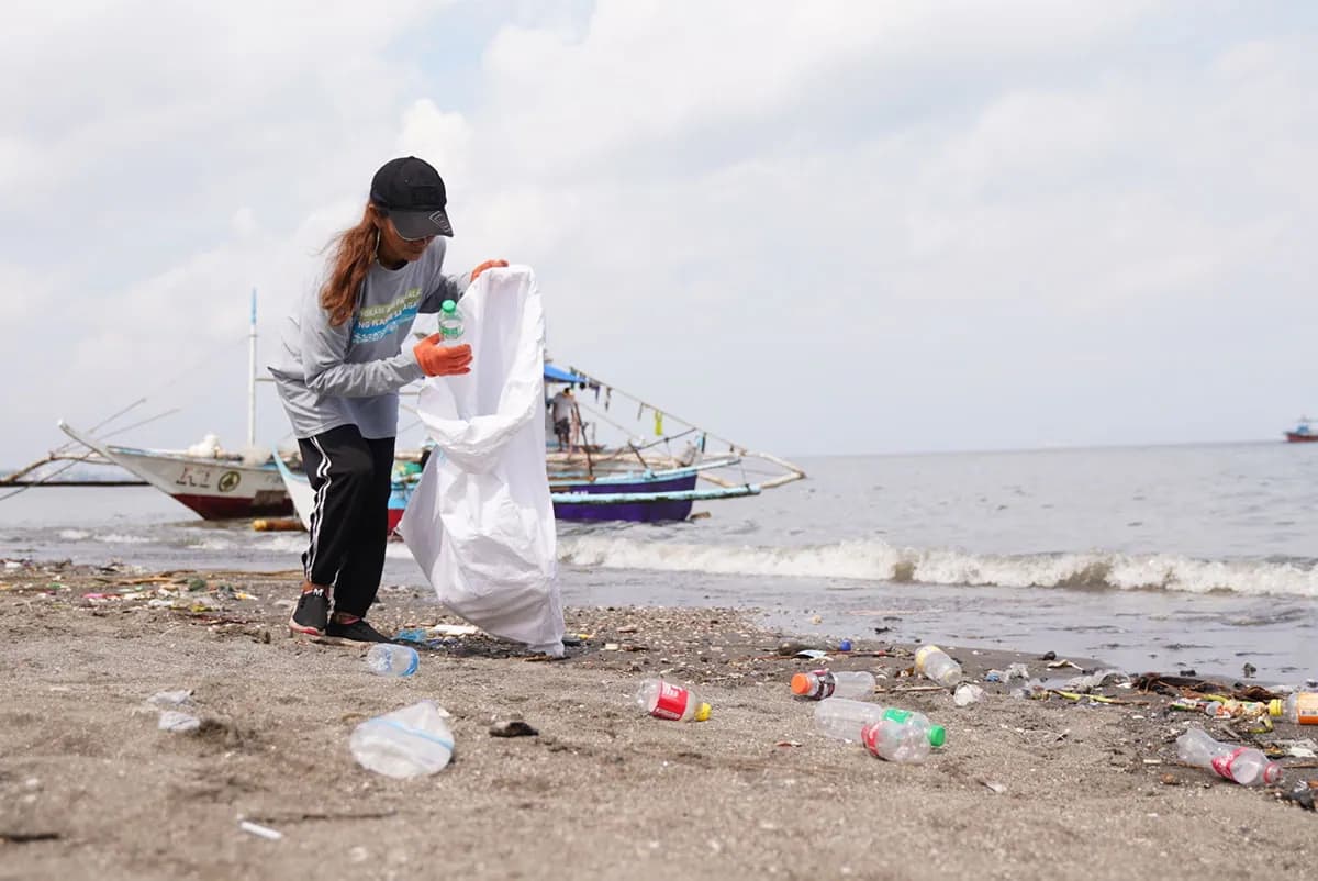 Fe del Rio, a Plastic Bank member in the Philippines, works daily to clean the shoreline—turning plastic waste into hope for her family and community
