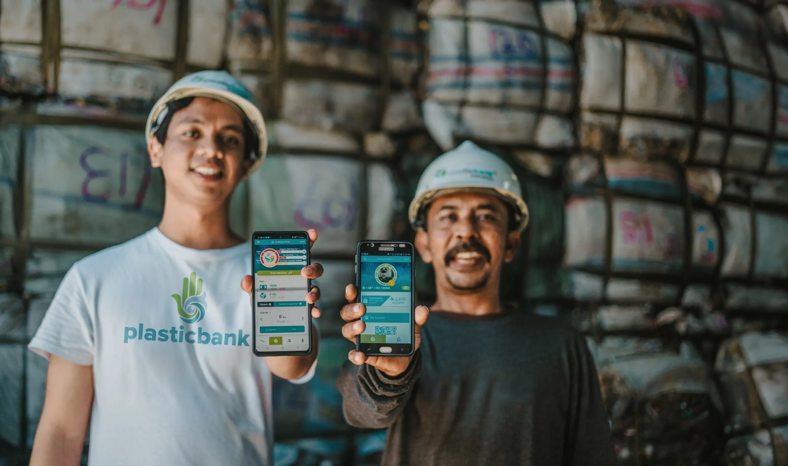 Plastic Bank staff and collector showing the app