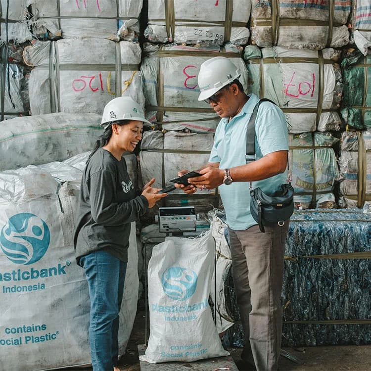 The market value of plastic exchange at the Plastic Bank collection branch is provided in cash, while the extra benefit is transferred via the PlasticBank® app.